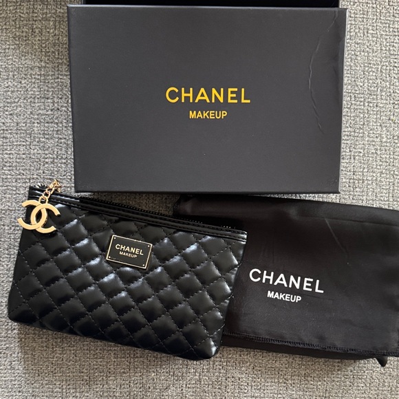 CHANEL Handbags - CHANEL Black Quilted Cosmetic Pouch with Gold CC Charm